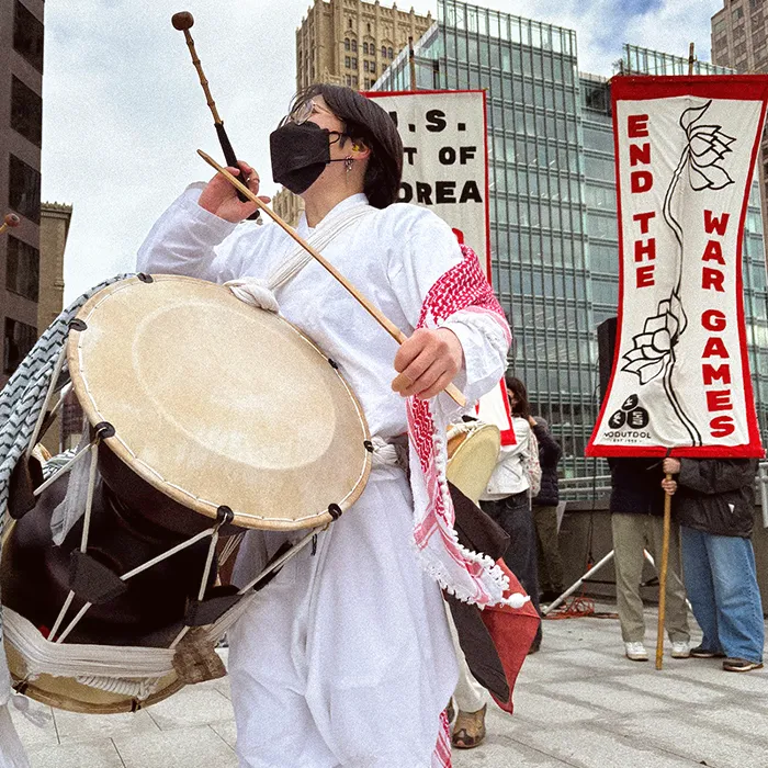 Close up of a person drumming.